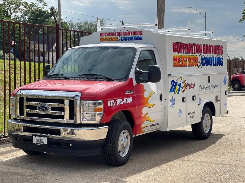 Red Buffington Brothers Heating & Cooling service truck branded with Emergency service and the Poplar Bluff phone number.